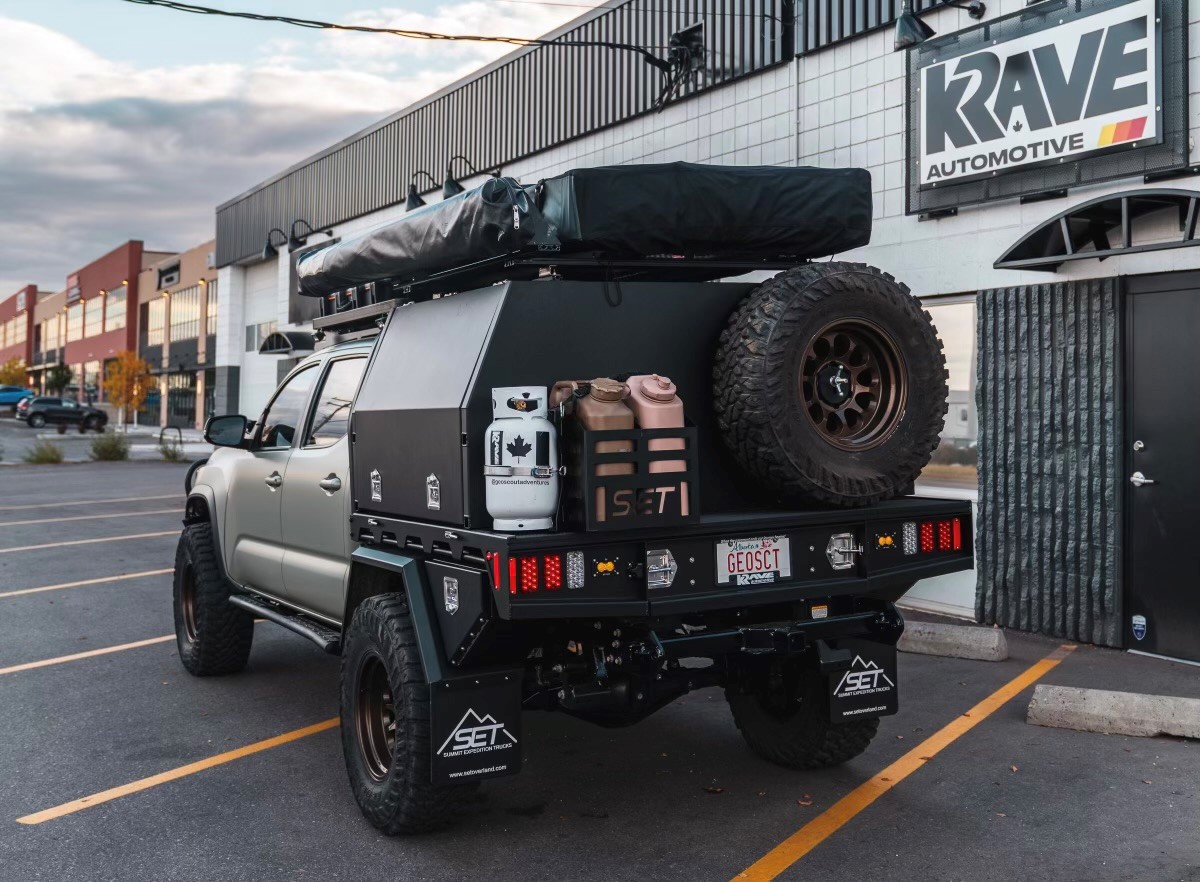 SUMMIT EXPEDITION TRUCKS TOYOTA TACOMA KRAVE AUTOMOTIVE DOUBLE CAB SHORT BOX BED EXPEDITION 60 THREE QUARTER CANOPY FLATBED TRUCK 1